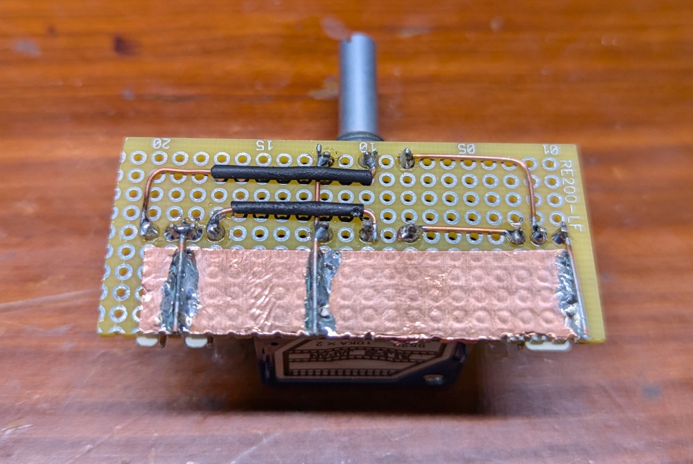 Tiny little board for the level control. Using a board to hold connectors rather than directly soldering the wires to the potentiometer pins makes (dis)assembly easier should servicing be required in the future.