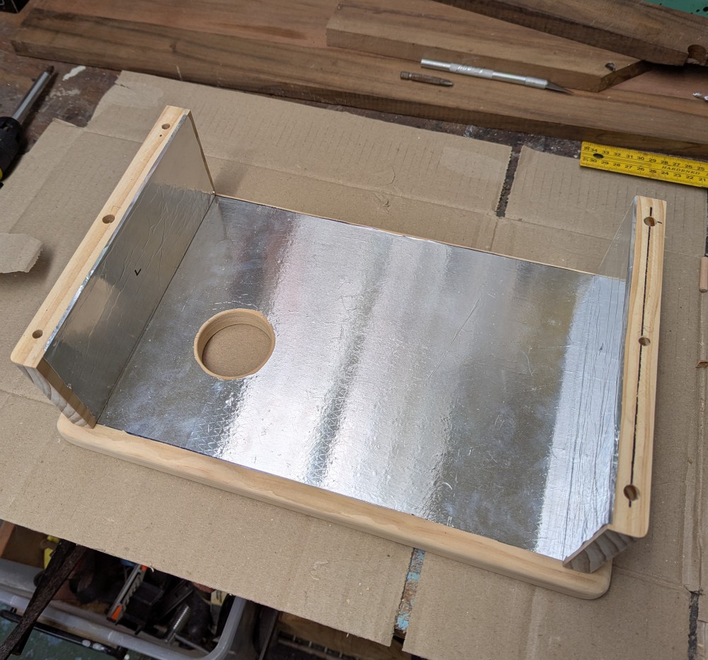 Preparing the sides for dowels to join them to the top.