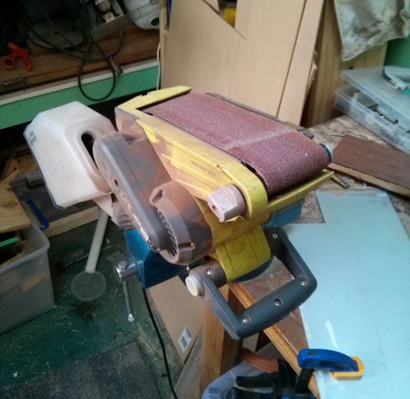 Why yes, the 'precision grinding tool' <i>is</i> a hand-held belt sander in a bench vice. Why you you ask? :)