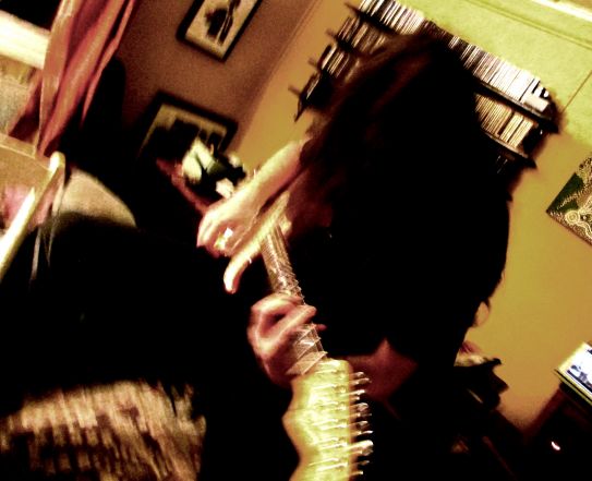 What can only be described as an 'artistic' shot of me playing guitar :)